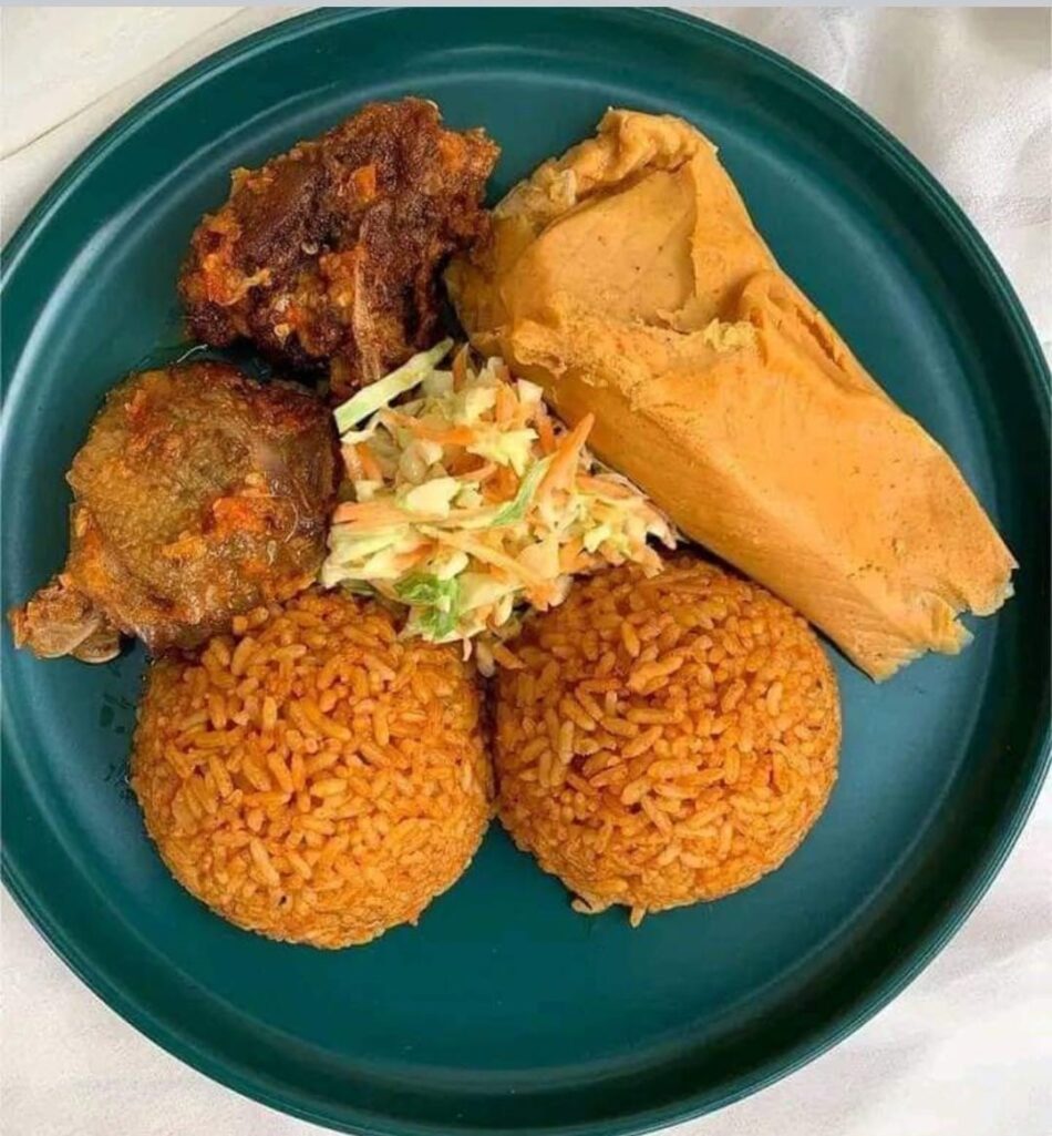 Jollof Rice with Moi Moi, Fish, and Coleslaw
